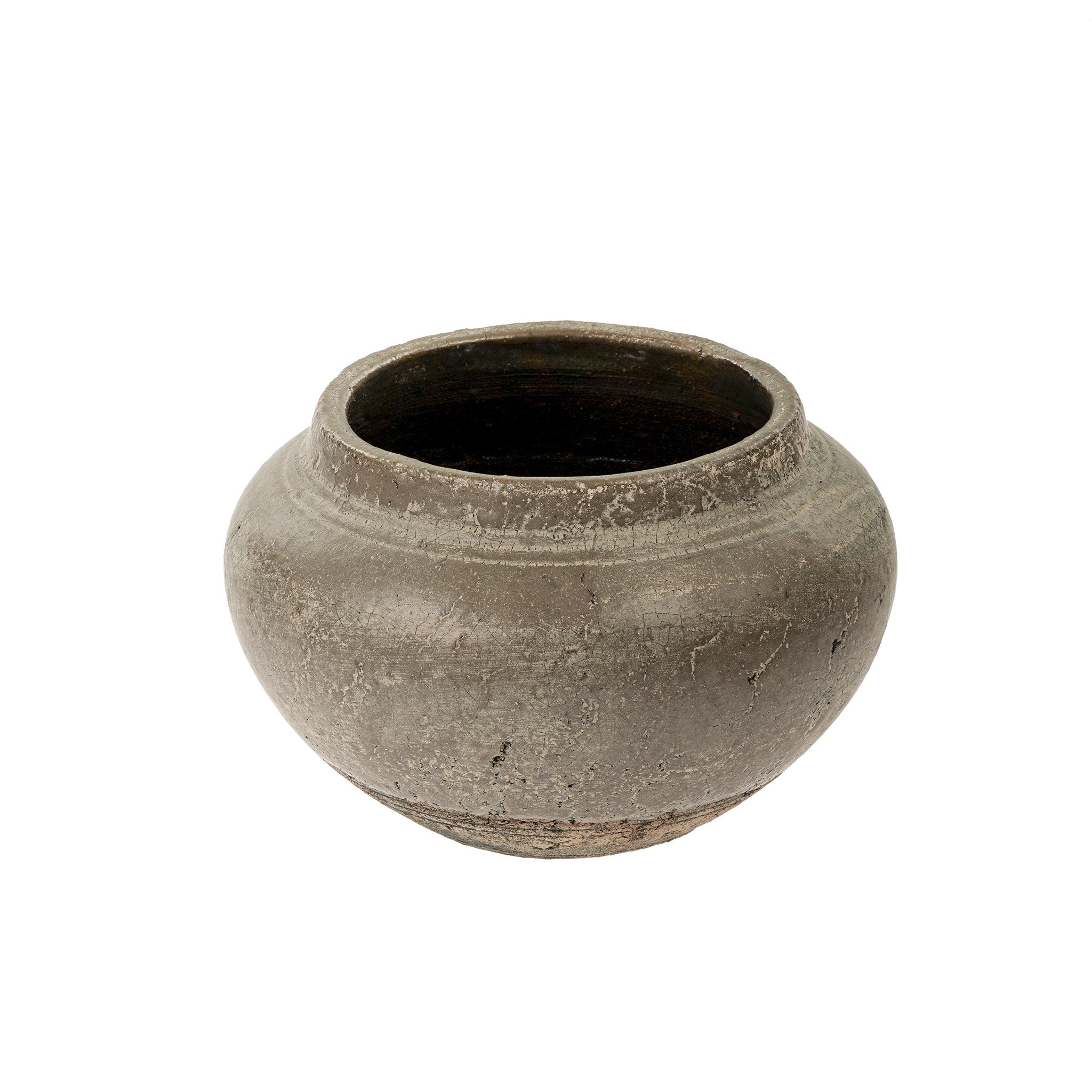 A small, handcrafted stoneware vase with a timeworn grey finish and substantial form, reminiscent of an unearthed artifact.