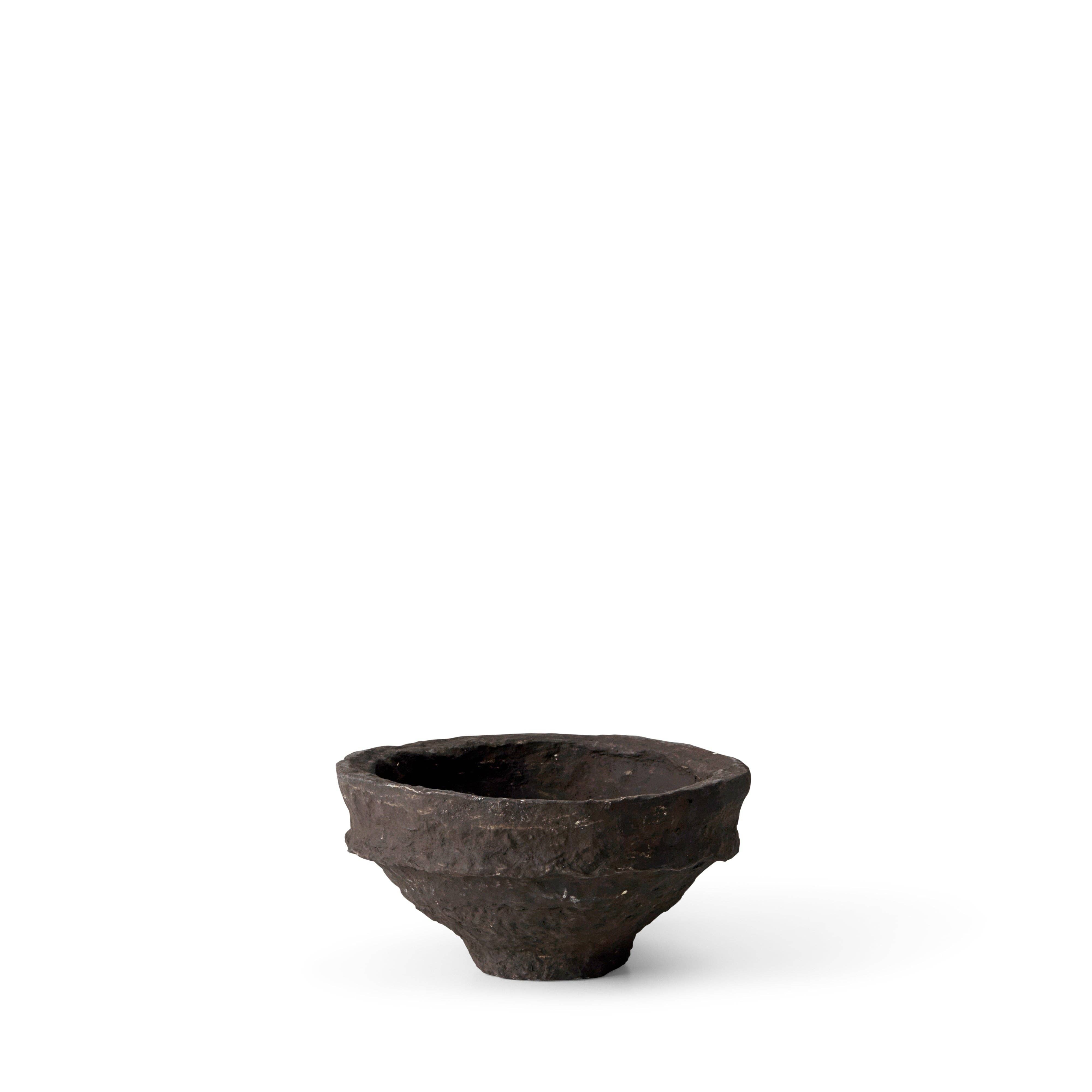 A small brown paper maché bowl with a rustic form, hand-made in India.