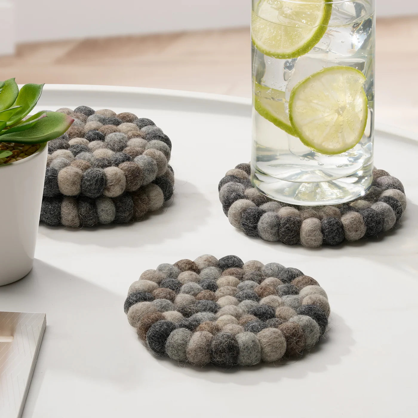 MODWOOL Felt Ball Four Piece Round 4" Diameter Coaster Set | Multi Natural